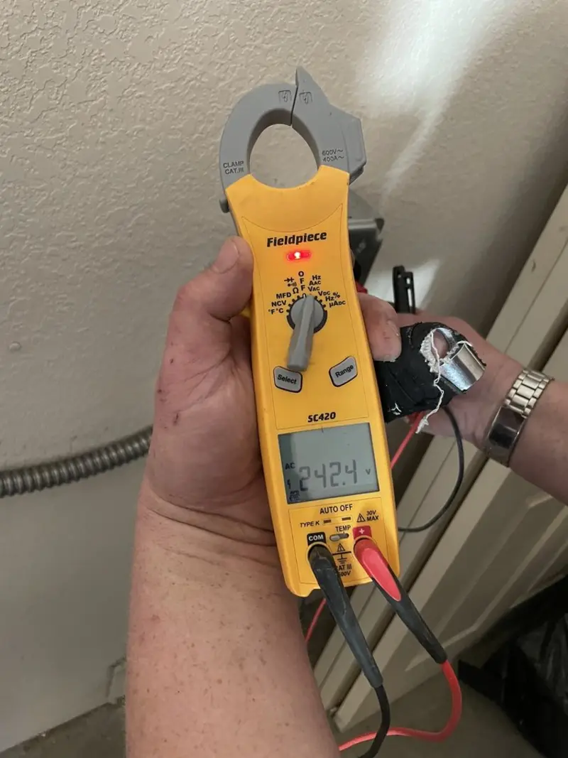 Voltage testing with clamp meter during Whole House Surge Protector in Redwood Falls